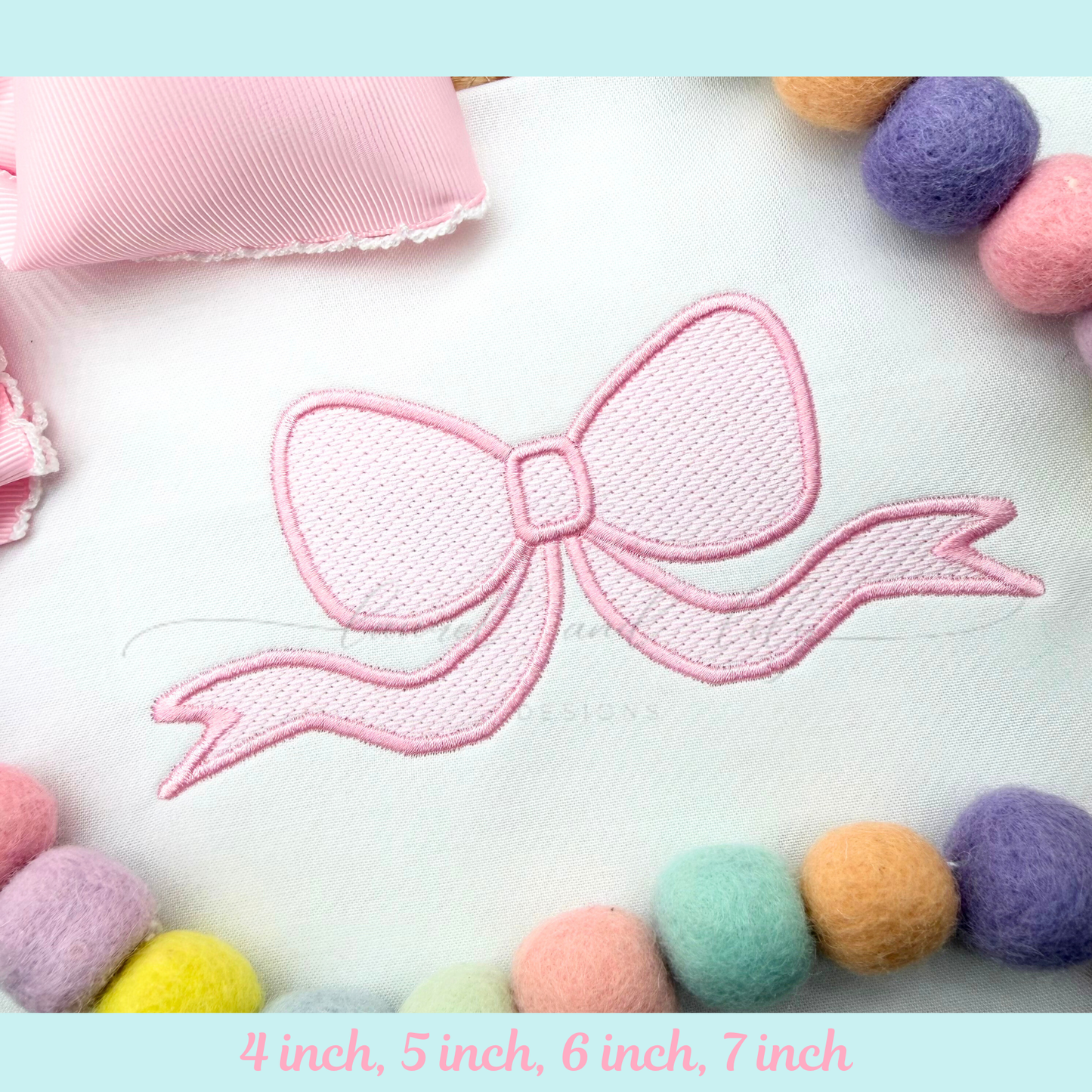 Pink bow design with colorful pom-poms on a light blue background